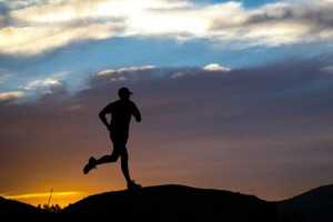 Trail runner at sunset